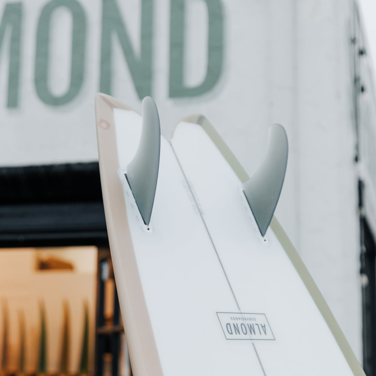 A board in front of a blurred building