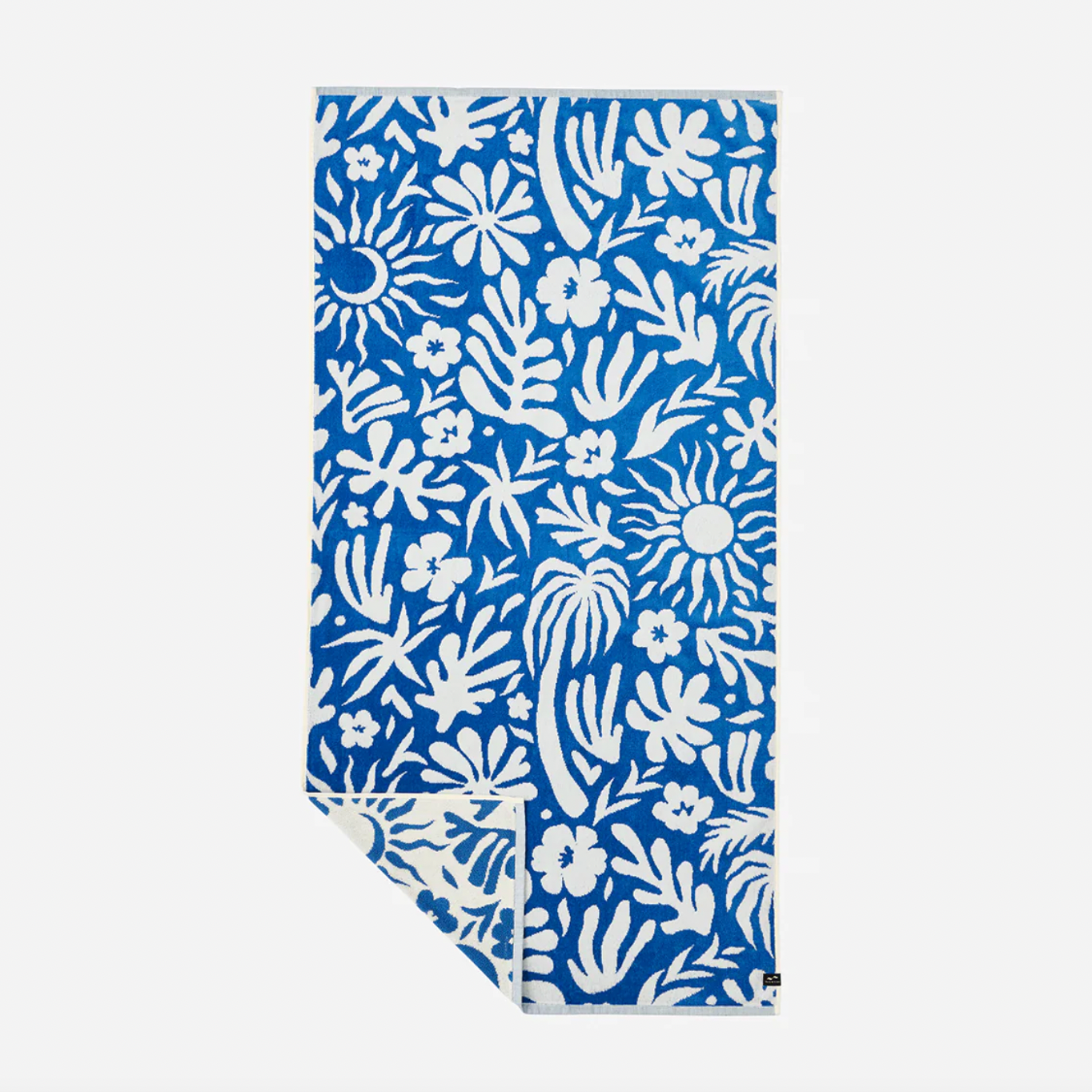 Blue towel with white floral and leaf pattern on a white background