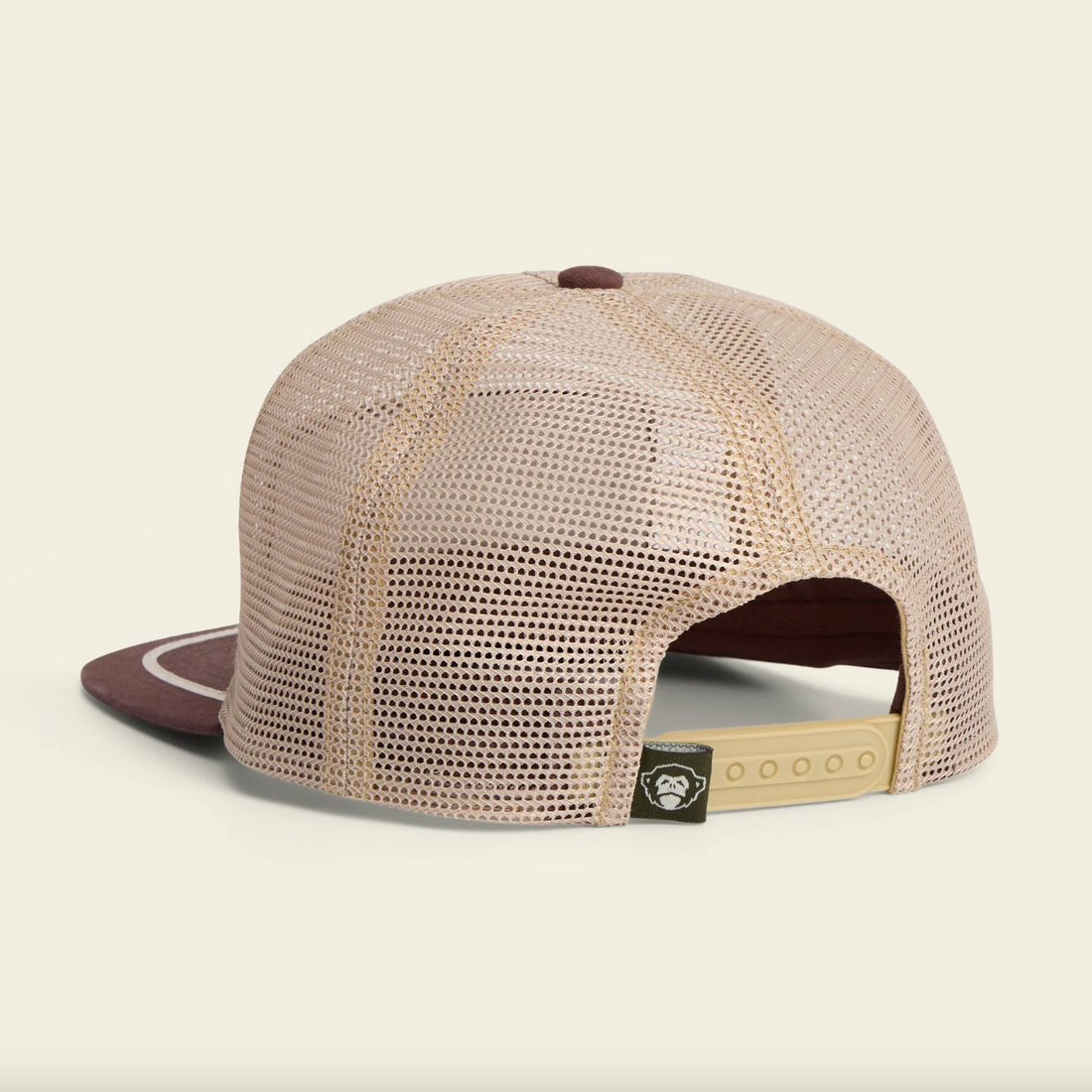 Trucker hat with 'Howler Brothers' logo on a beige background